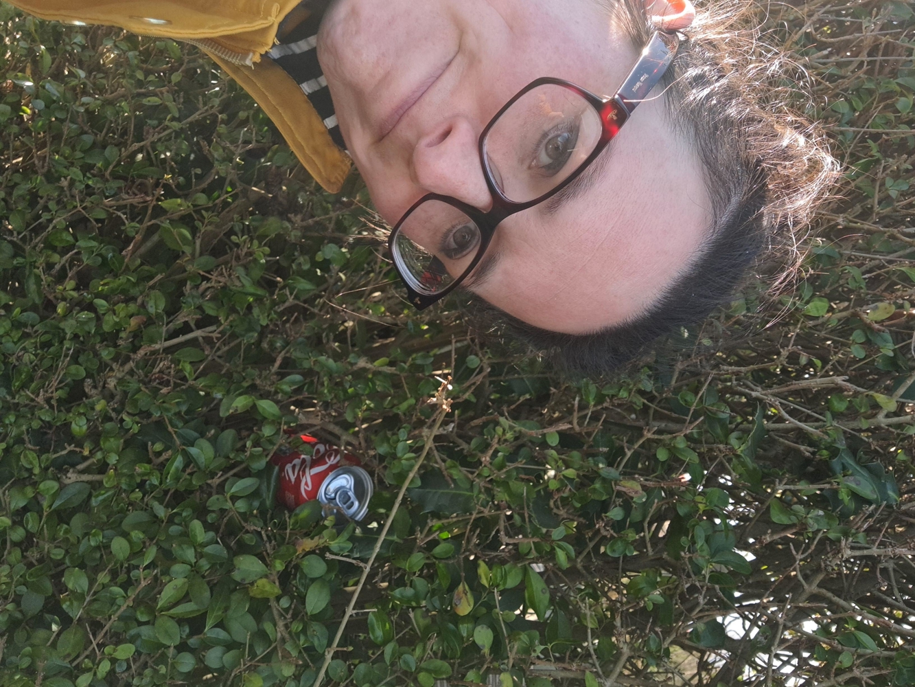 Heather with a can stuck in her hedge