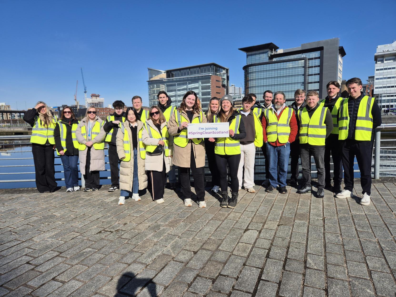 People posing after a litter pick in Glasgow