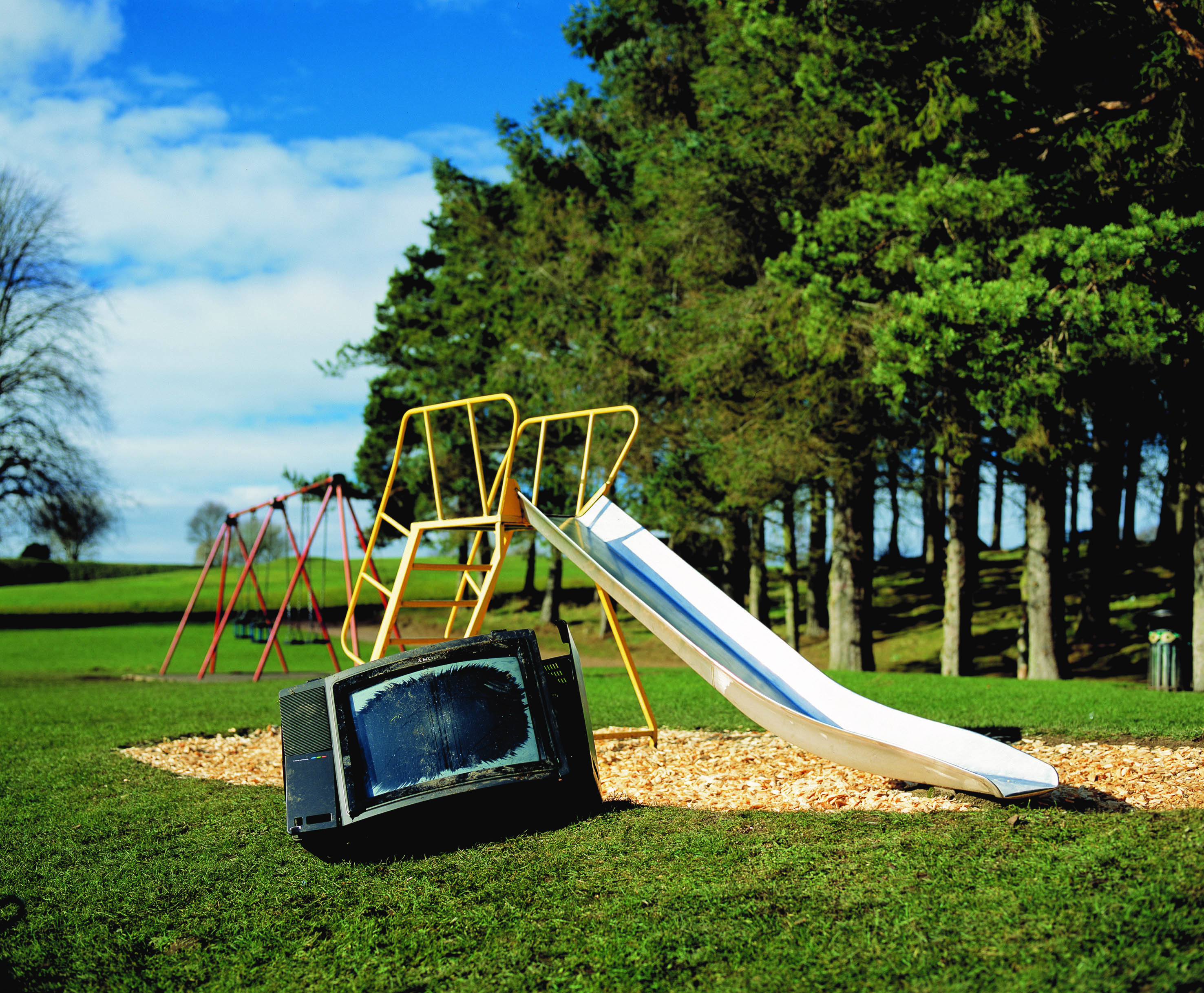 A TV that's been left in a children's park
