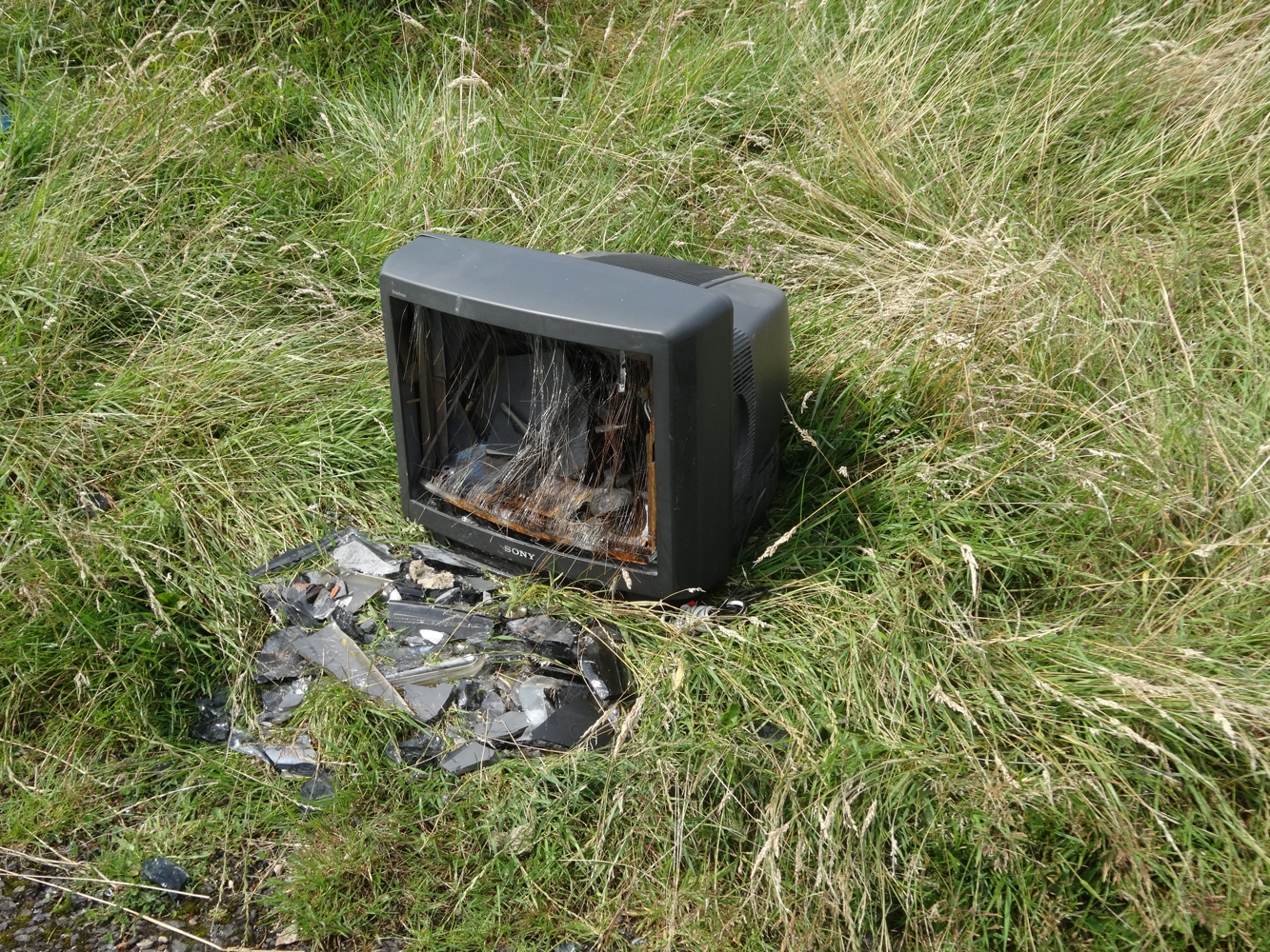 A smashed TV that's been flytipped
