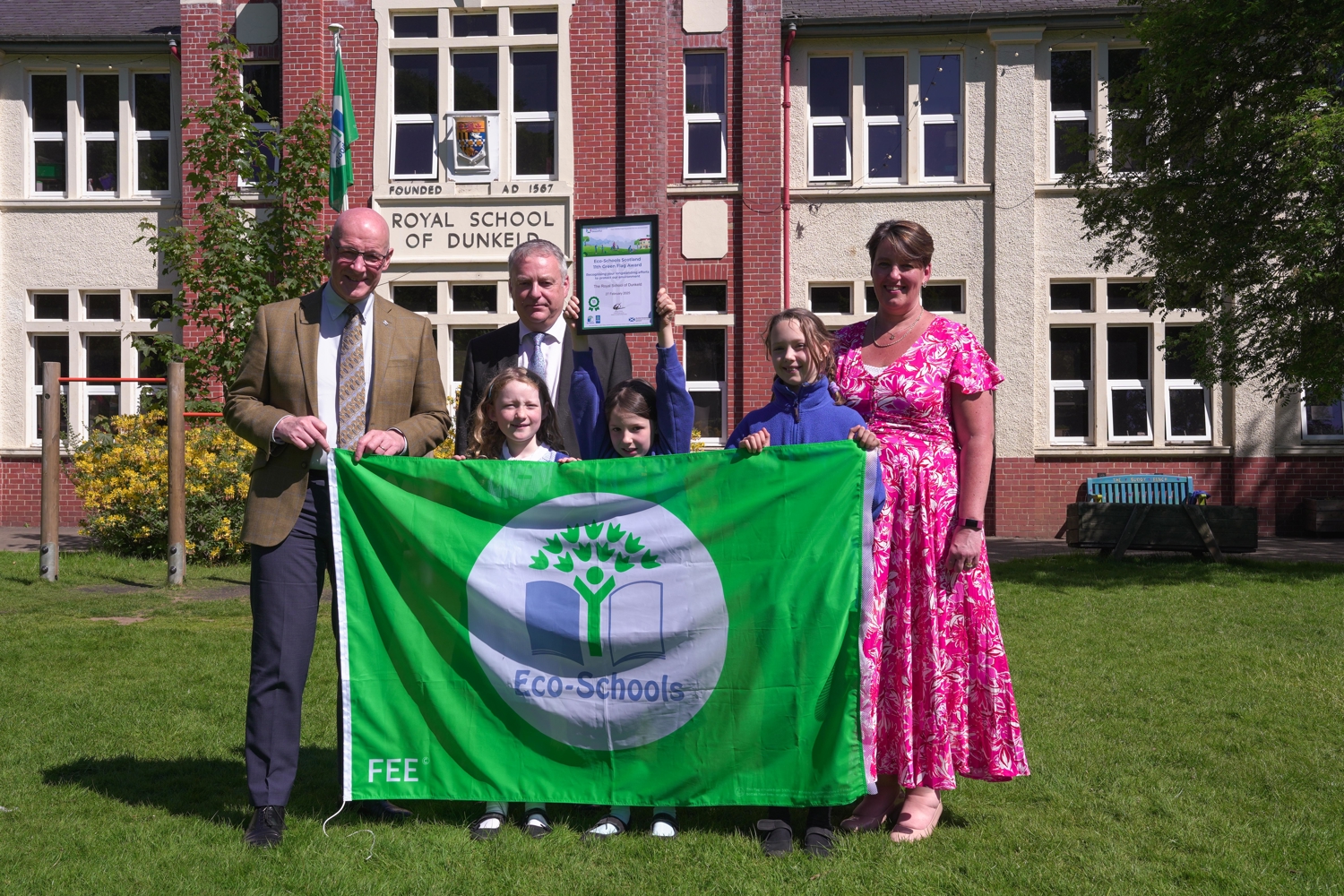 Scotland's First Minister John Swinney with Keep Scotland Beautiful Chief Executive Barry Fisher and pupils and the head teacher of Royal School of Dunkeld